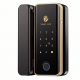 Keyplus smart glass door lock in a gold frame, featuring a black brushed panel with a gold-colored digital keypad and a bottom blue-ringed fingerprint sensor, suitable for office entry security.